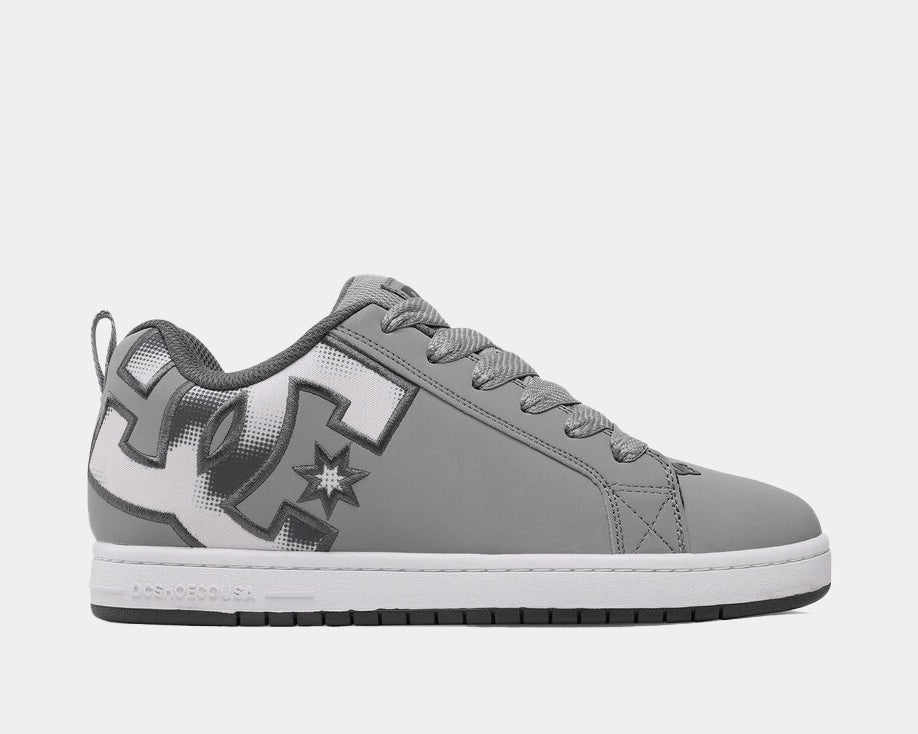 Grey low-top sneakers with lace-up front, DC logo side and star patch accents